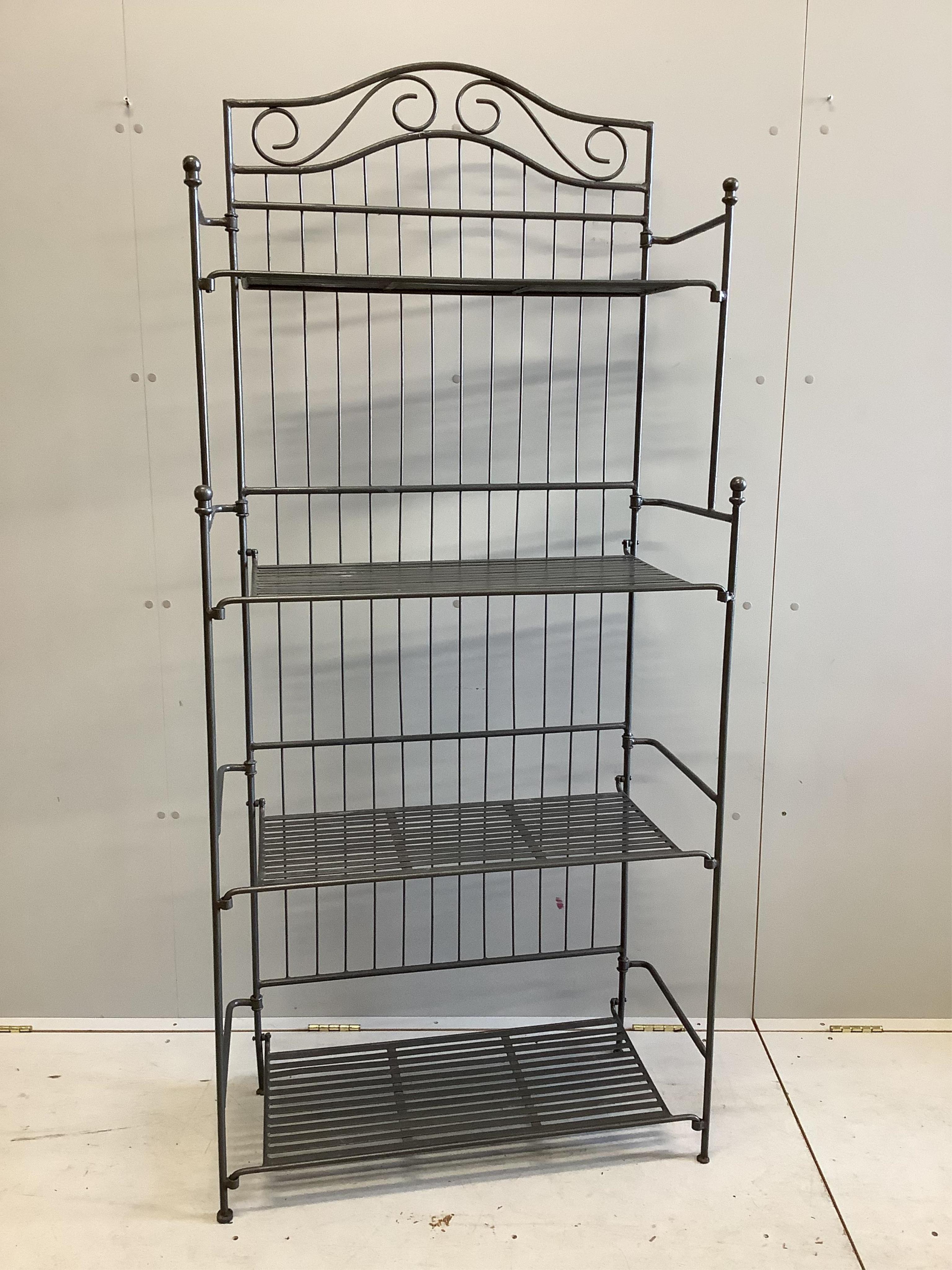 A modern wrought iron four tier baker's rack, width 82cm, height 186cm. Condition - good